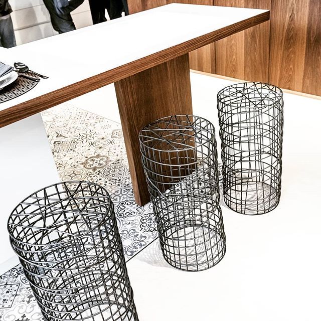 White, wood and pieces of texture define this kitchen. It’s the mix that moves the design forward. I’m not so very sure the stools would be conducive to lingering at the countertop if you know what I mean. Taken at the Porcelanosa booth in Milan....