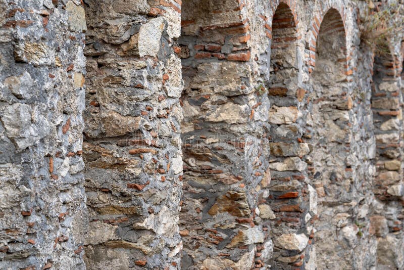 Ancient stone wall with arches royalty free stock images