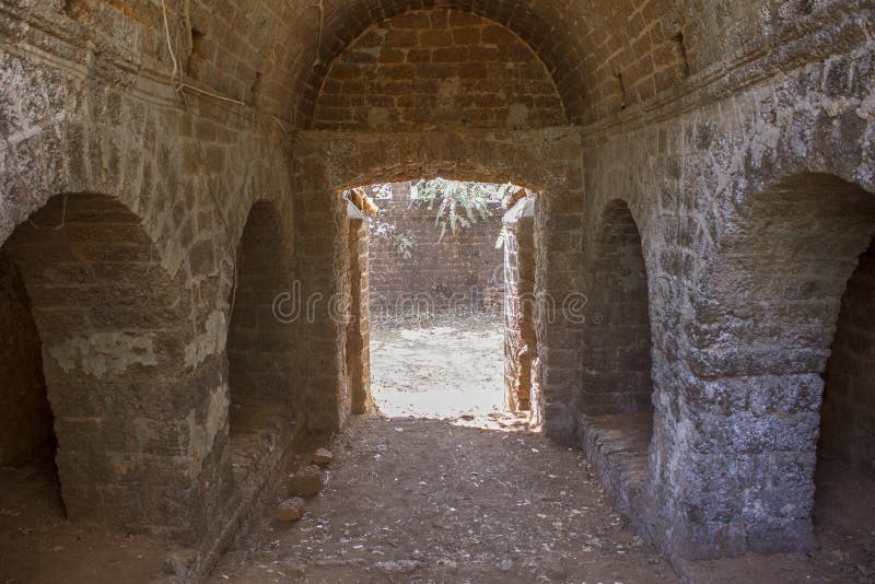 Corridor with arches of an ancient abandoned stone castle stock images