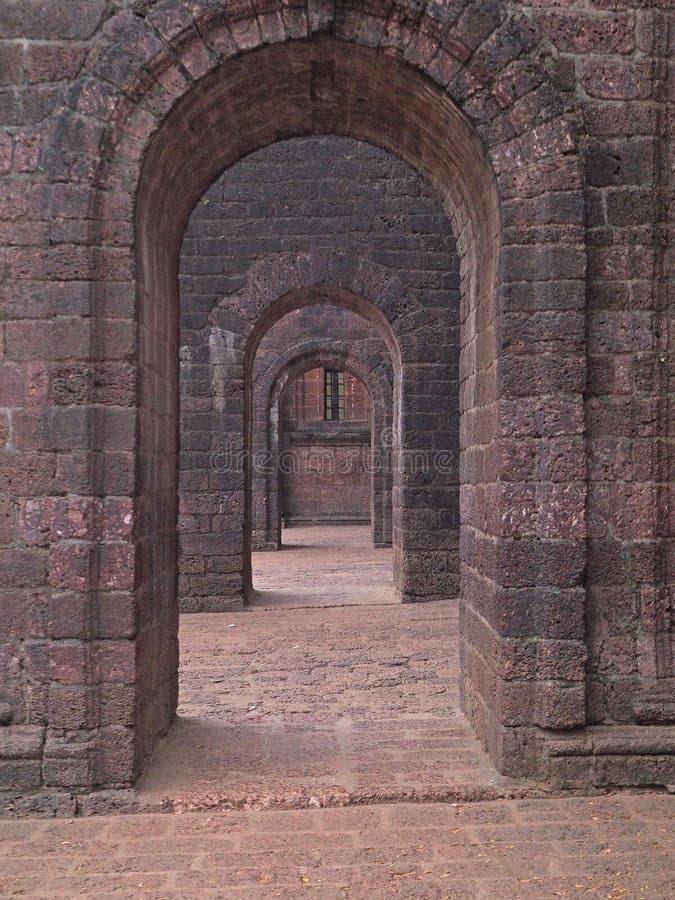 View of the old stone arches of the chapel going into the distance. stock photo