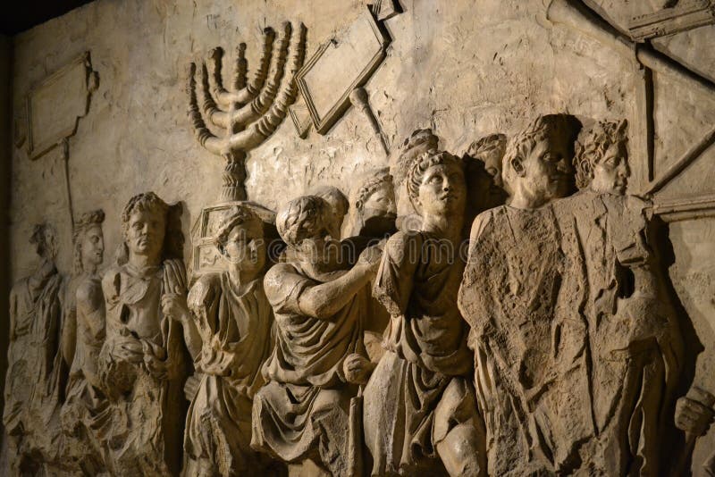 Wall relief on arch of titus depicting Menorah taken from temple in Jerusalem in 70 AD - Israel history, Jewish war royalty free stock images